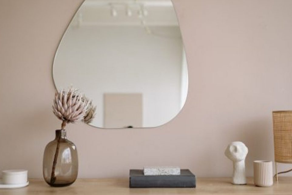 A Mirror Wall Above a Cabinet